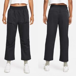 Nike Sportswear Dri-FIT Tech Pack Women's Mid-Rise Woven Pants in Black DQ6659